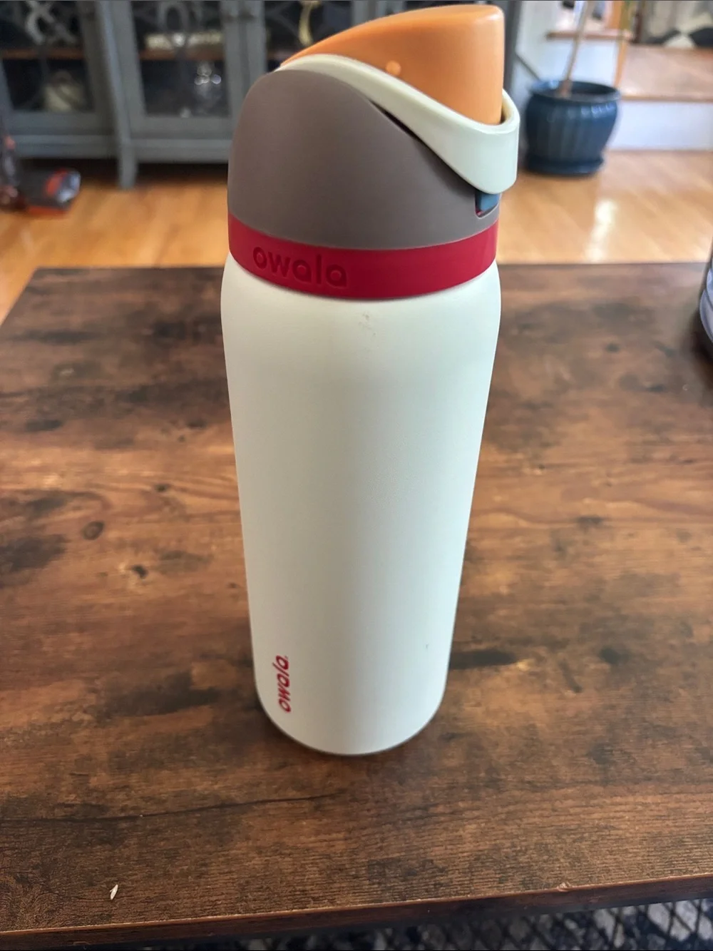 Contigo white bottle with orange lid and red band 32 oz